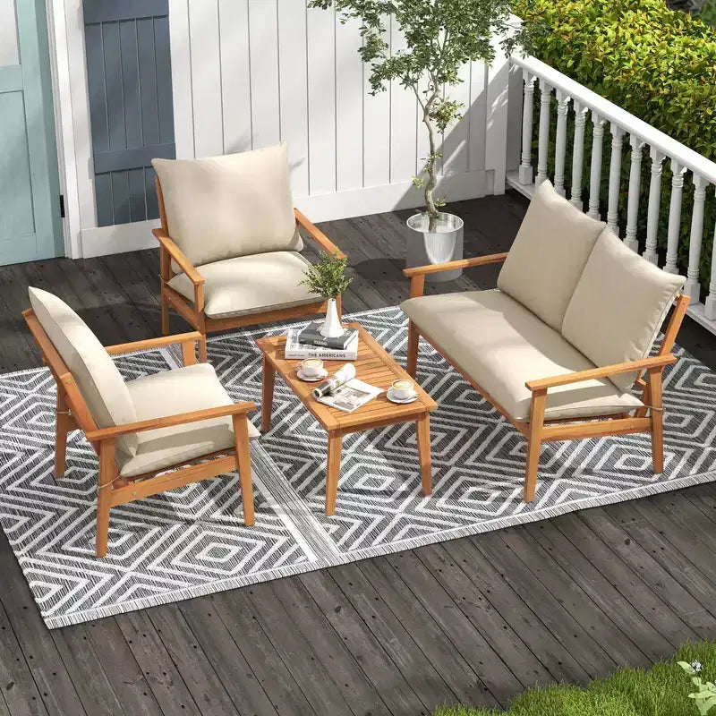 Ensemble de mobilier de patio Costway 4 pièces en bois d'acacia avec coussins moelleux et table basse