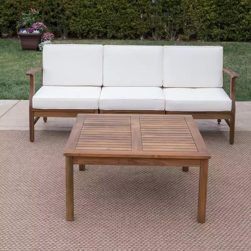 Ensemble canapé 3 places et table basse d'extérieur Abena en bois d'acacia avec coussins GDFStudio