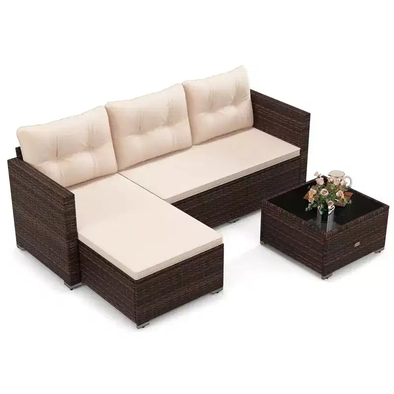 Ensemble de meubles d'extérieur en rotin 4 places Costway avec table basse en verre trempé et coussins moelleux