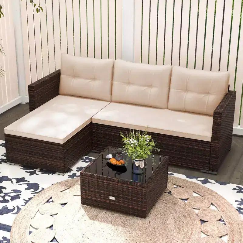Ensemble de meubles d'extérieur en rotin 4 places Costway avec table basse en verre trempé et coussins moelleux